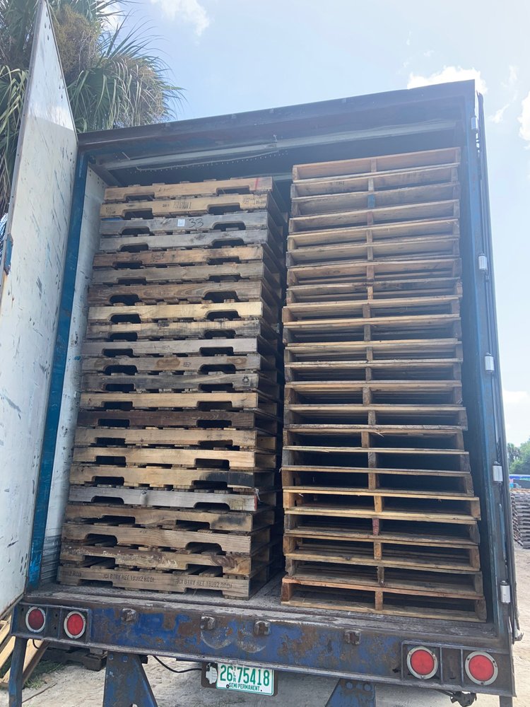 Recycled pallets stacked in delivery truck