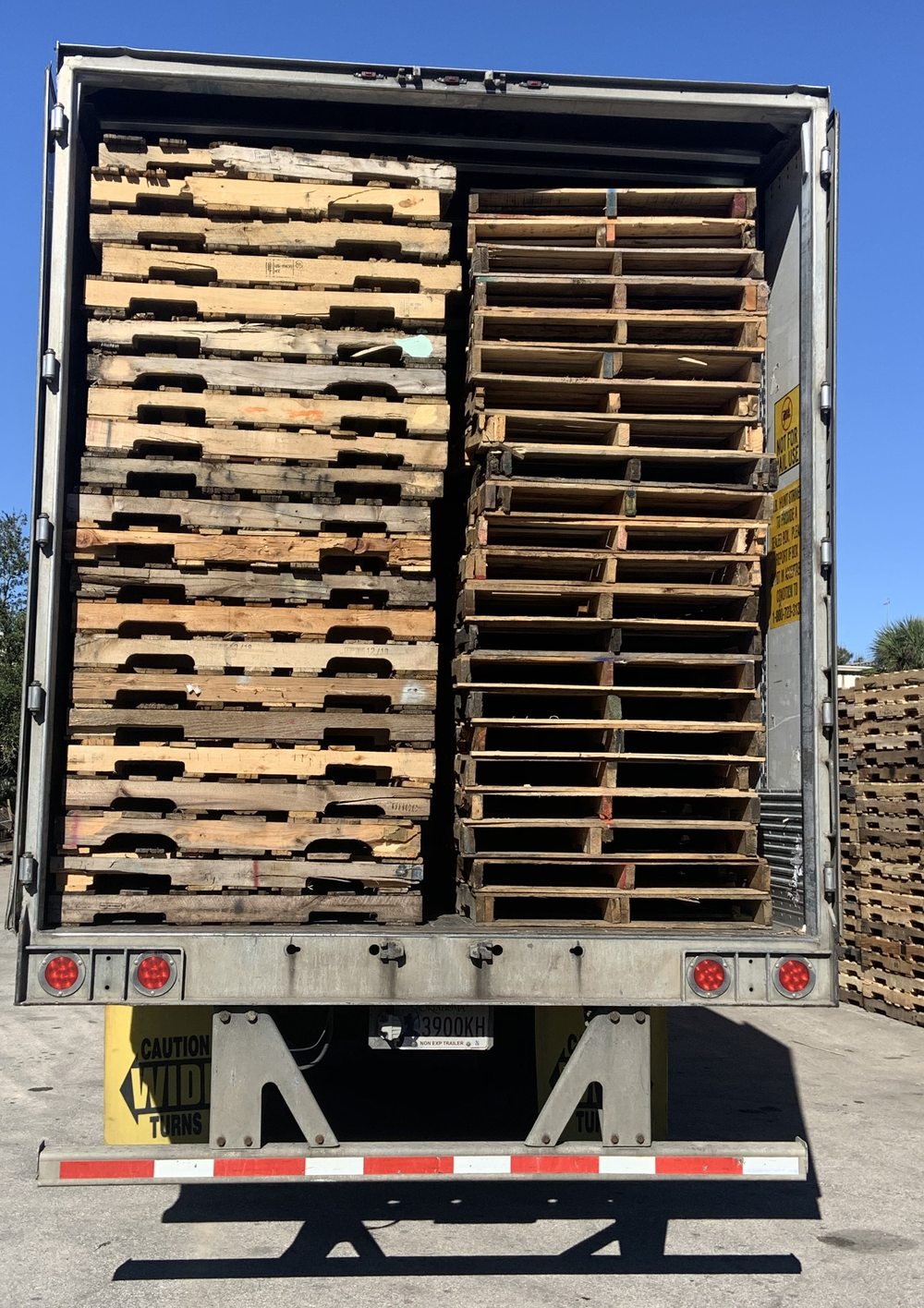 Dry van trailer loaded with mixed pallets on sunny Florida delivery day