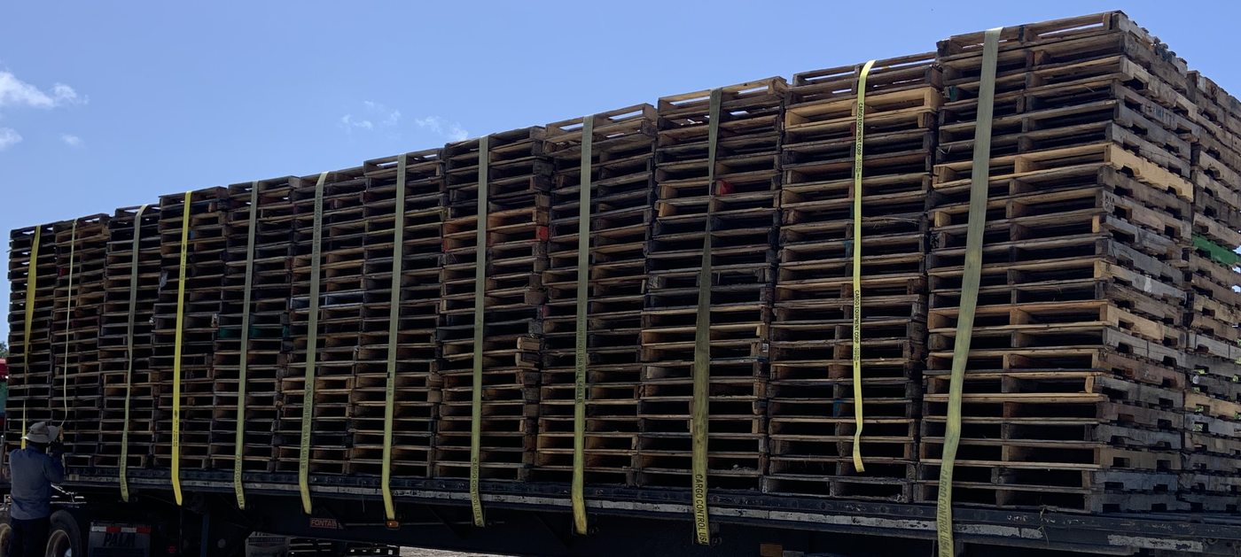 Full flatbed load of ISPM-15 heat treated pallets ready for Florida export delivery
