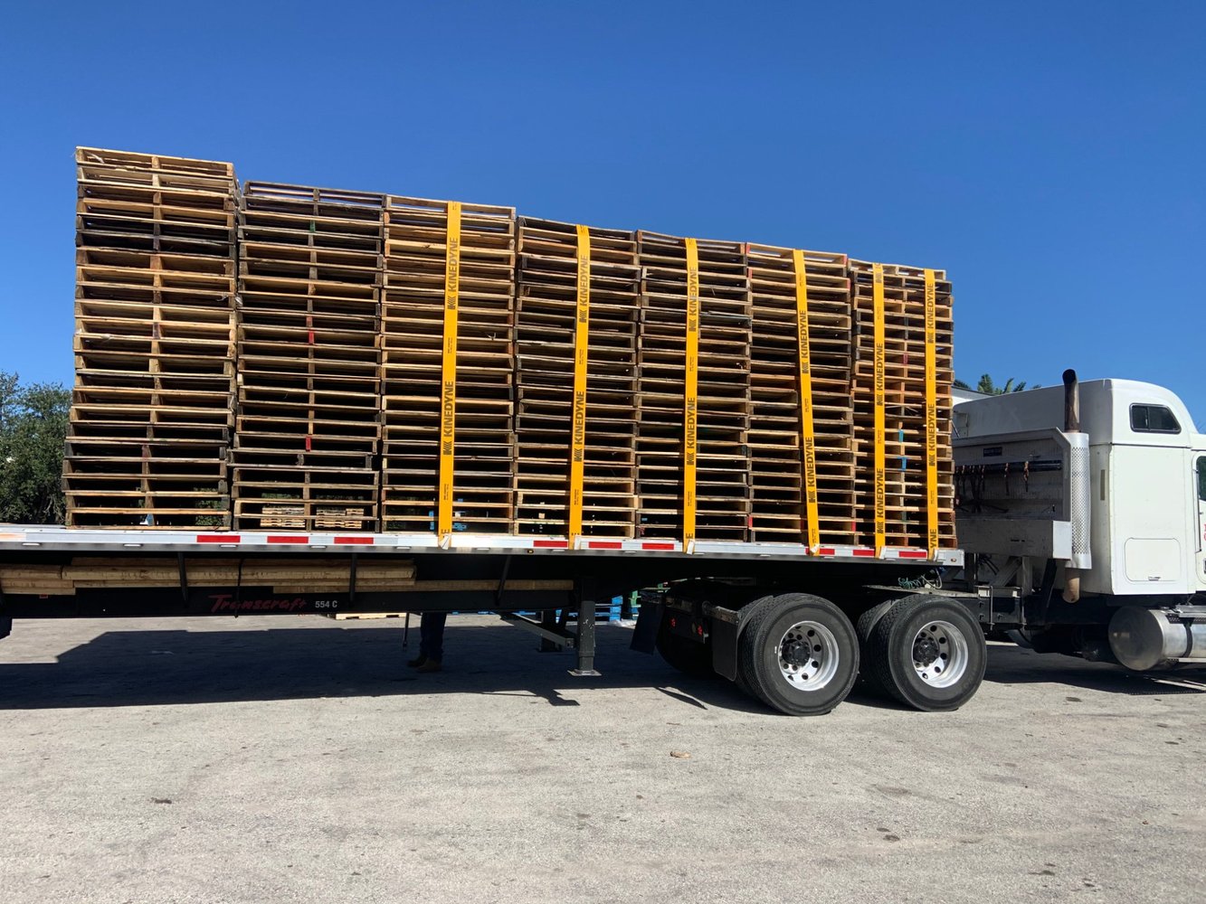 Custom pallets on flatbed with straps