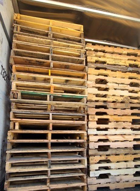 New and recycled pallets loaded in delivery trailer Florida pallet supply