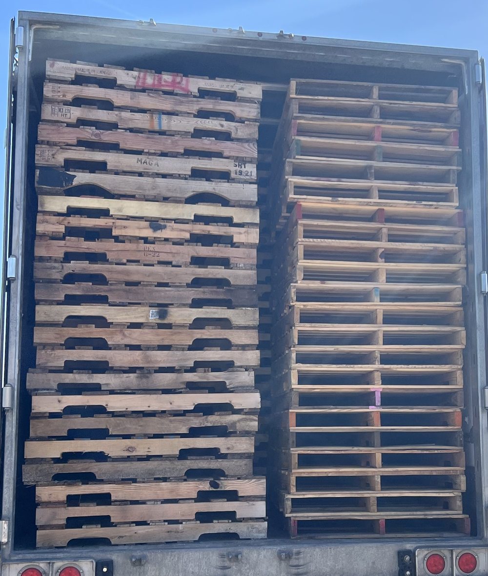 Loaded delivery trailer with recycled pallets Florida pallet supply